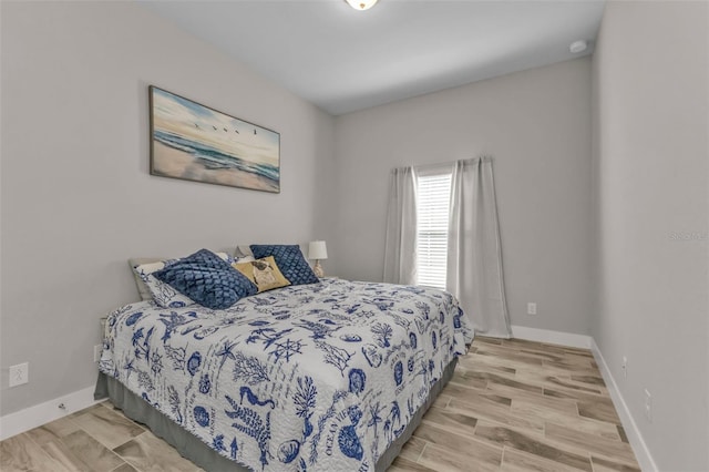 bedroom with light hardwood / wood-style floors