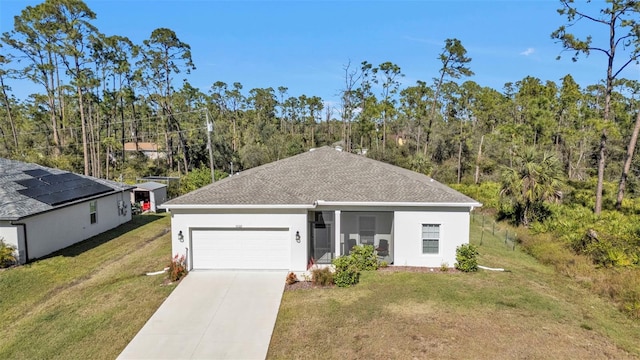 single story home with a front yard and a garage