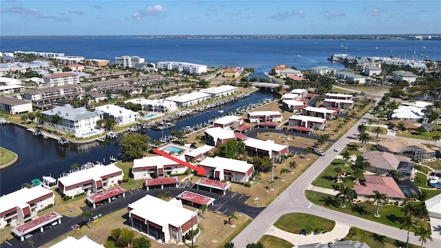 birds eye view of property with a water view