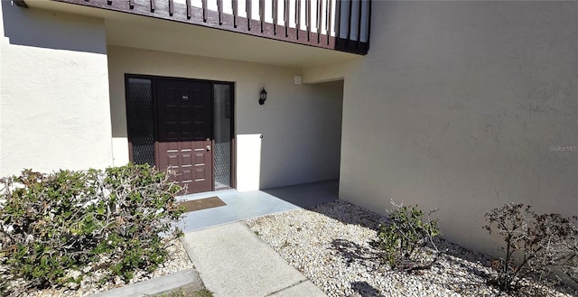 doorway to property featuring a balcony