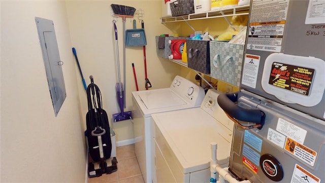 laundry area featuring light tile patterned floors and independent washer and dryer