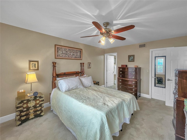 bedroom featuring ceiling fan and light carpet