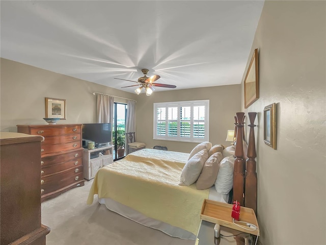 bedroom with light carpet and ceiling fan