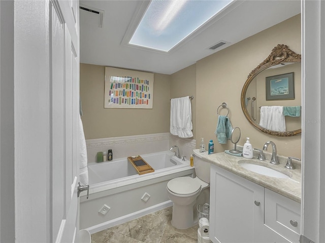 bathroom with vanity, toilet, and a bathing tub