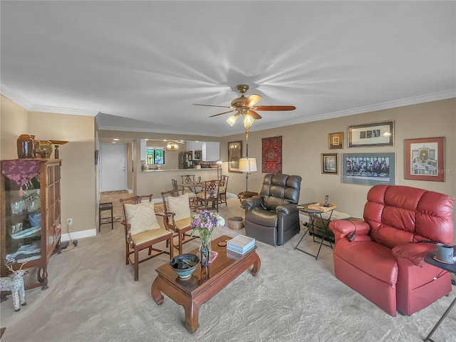 carpeted living room featuring crown molding and ceiling fan