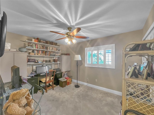 office with light carpet and ceiling fan