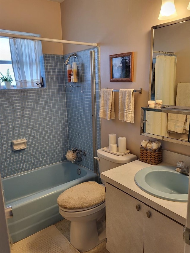 full bathroom with vanity, shower / bathtub combination with curtain, and toilet