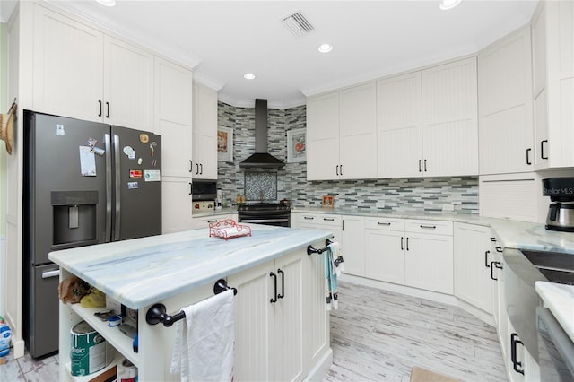 kitchen featuring white cabinets, black range, wall chimney exhaust hood, and stainless steel refrigerator with ice dispenser