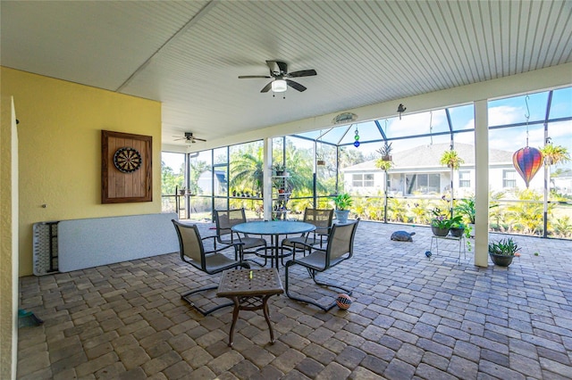 view of patio / terrace featuring a lanai and ceiling fan