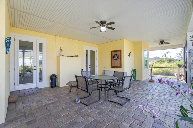 view of patio with french doors and ceiling fan