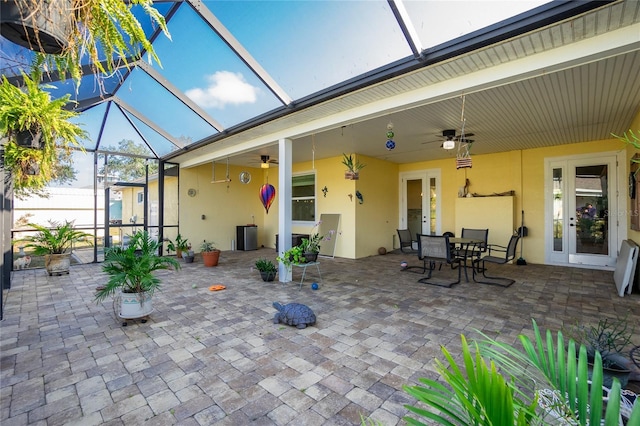 exterior space with a lanai and ceiling fan