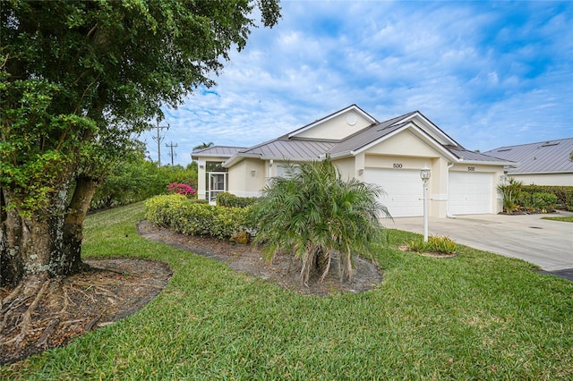 view of front facade featuring a garage and a front yard