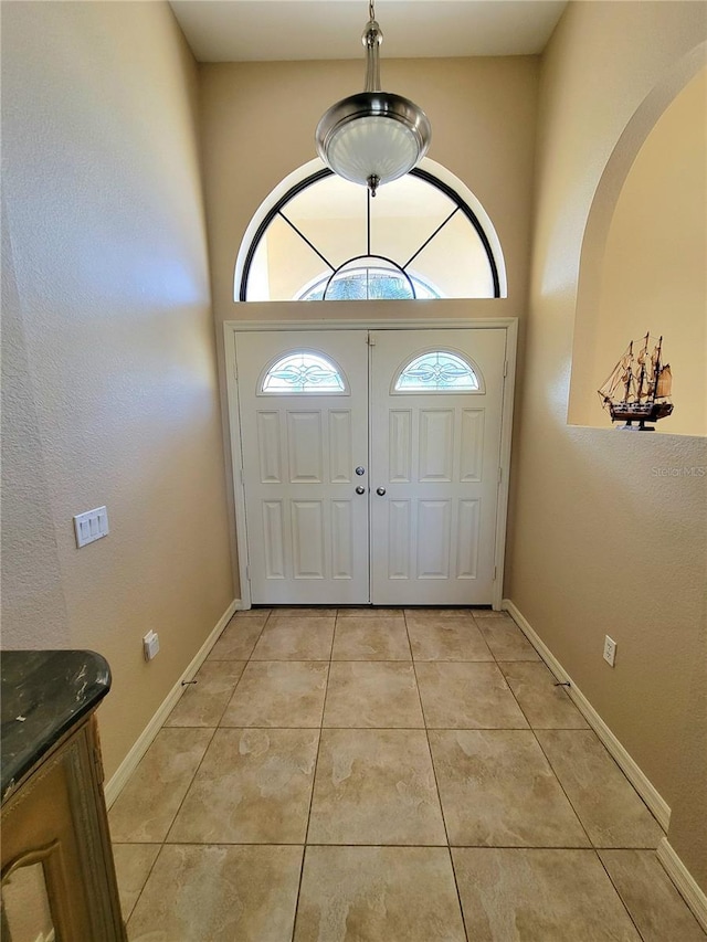 entryway featuring light tile patterned flooring