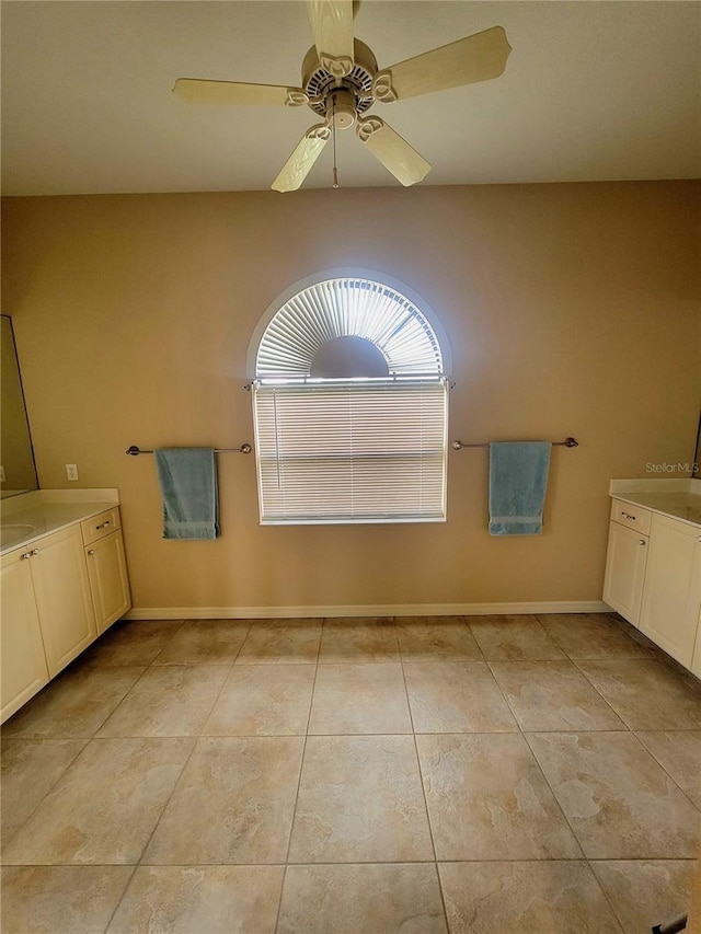 bathroom featuring tile patterned flooring and ceiling fan