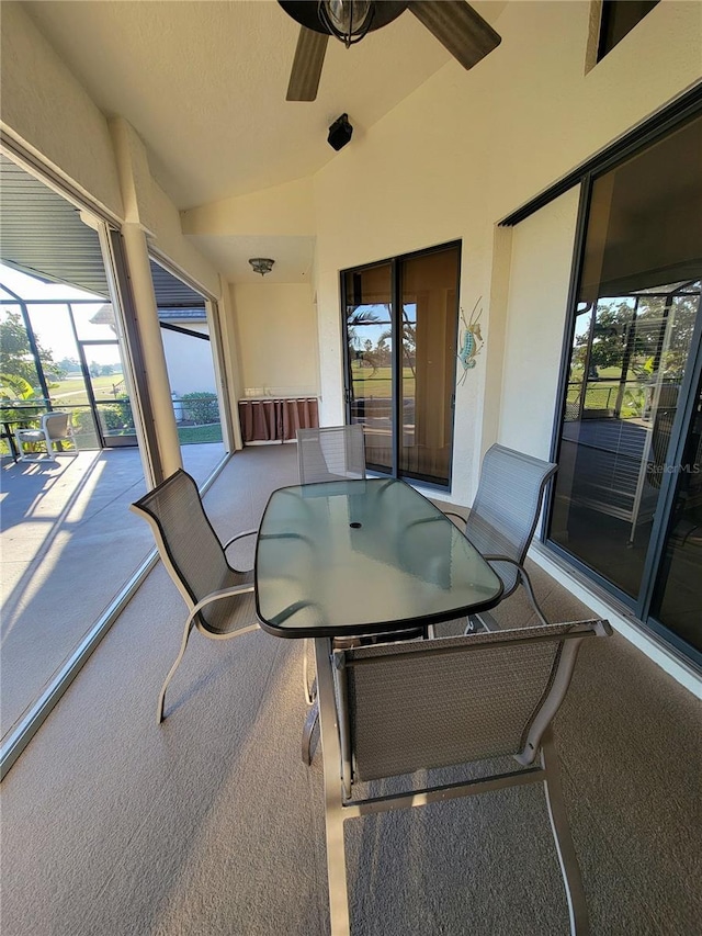 exterior space with ceiling fan and lofted ceiling