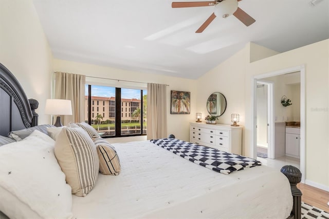 bedroom with ceiling fan, ensuite bathroom, lofted ceiling, and light hardwood / wood-style floors