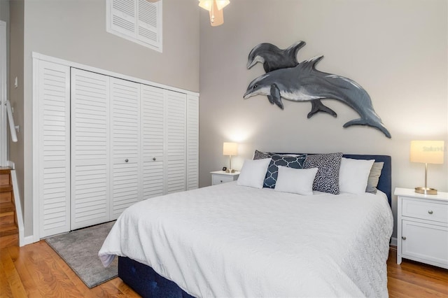 bedroom featuring light hardwood / wood-style flooring and a closet