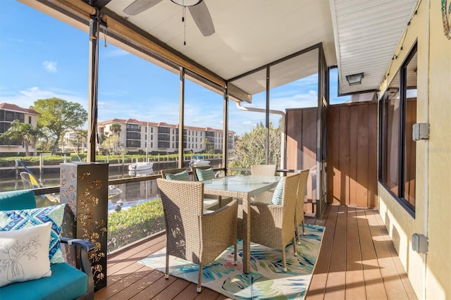 sunroom featuring ceiling fan