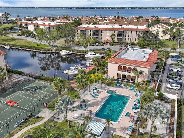 birds eye view of property with a water view