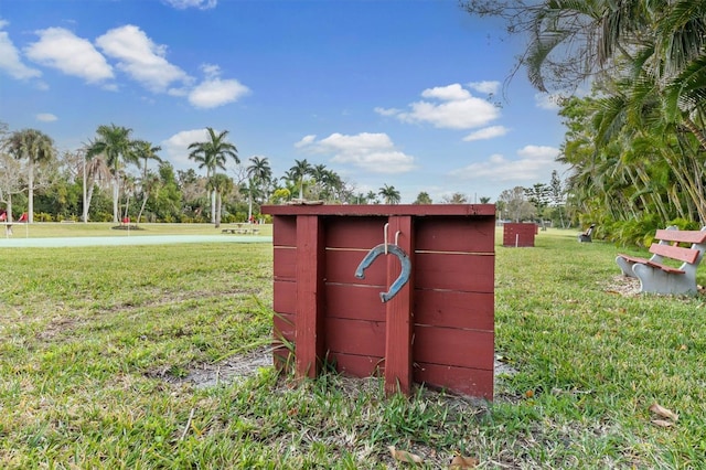 view of outbuilding featuring a yard