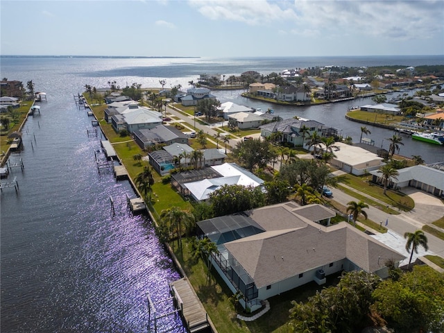 aerial view featuring a residential view and a water view