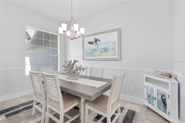 dining area with a healthy amount of sunlight and a chandelier