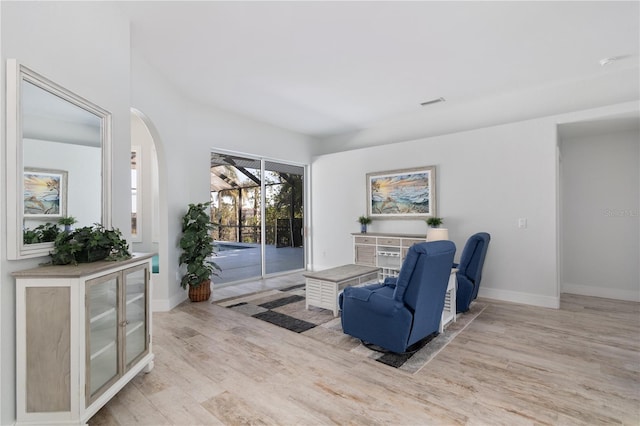 living area with light hardwood / wood-style flooring