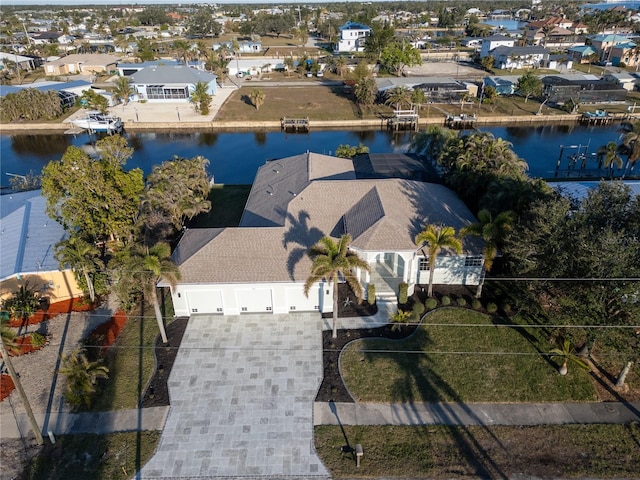 birds eye view of property featuring a water view and a residential view