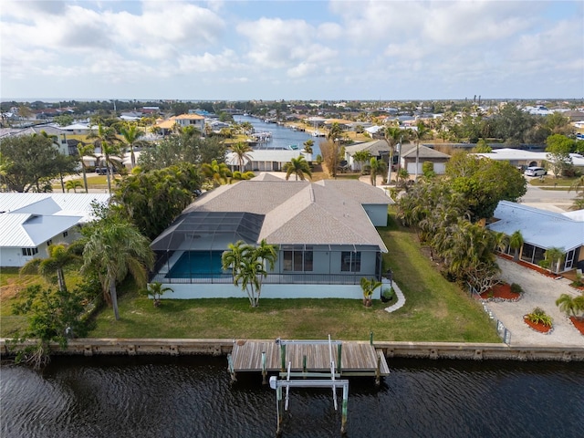 bird's eye view with a residential view and a water view