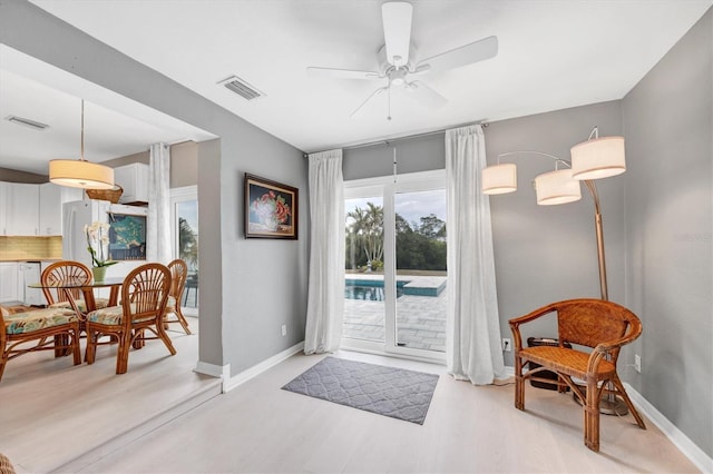 entryway featuring ceiling fan and light hardwood / wood-style floors