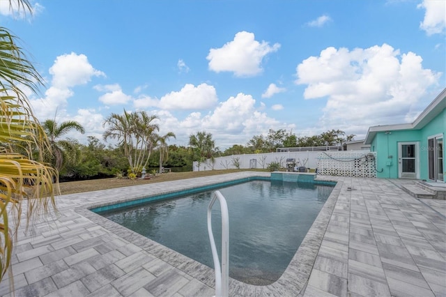 view of swimming pool with a patio