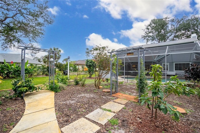 view of yard with glass enclosure