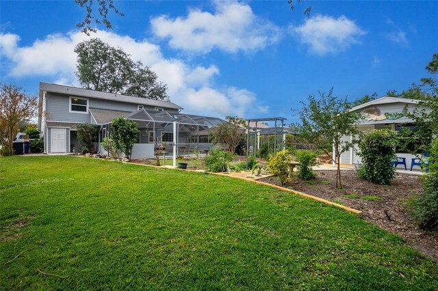 view of yard with glass enclosure