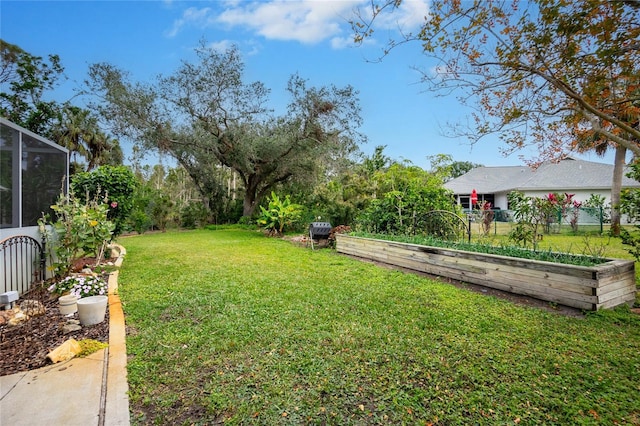 view of yard featuring glass enclosure