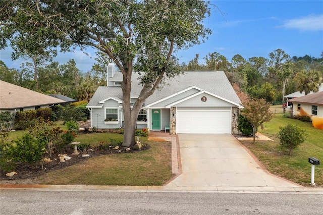 view of front facade with a garage and a front lawn