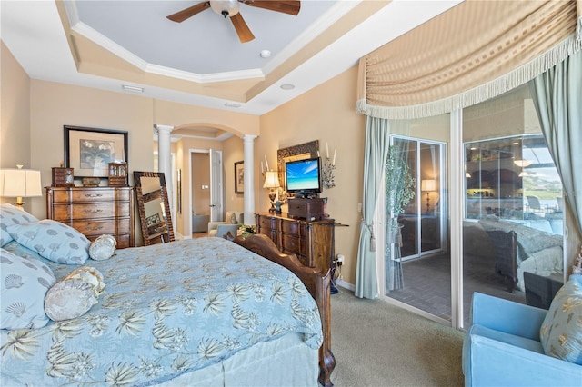 bedroom featuring carpet flooring, ornate columns, ceiling fan, access to exterior, and a raised ceiling