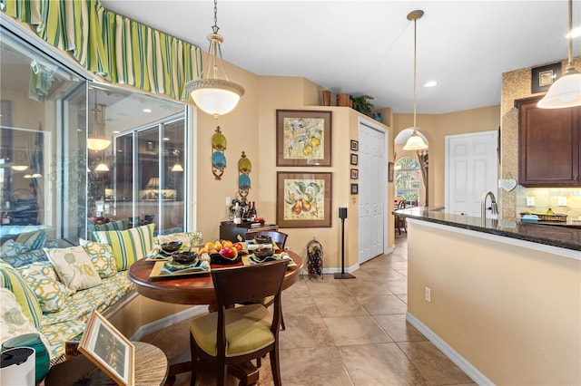 dining area with light tile patterned floors