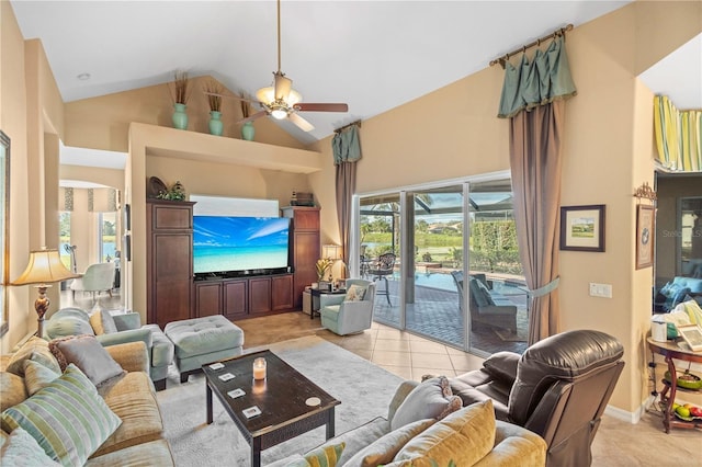 tiled living room featuring high vaulted ceiling and ceiling fan