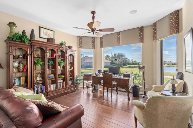 office area featuring a wealth of natural light, ceiling fan, and wood-type flooring