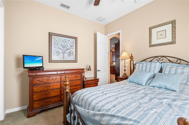 bedroom featuring light colored carpet and ceiling fan