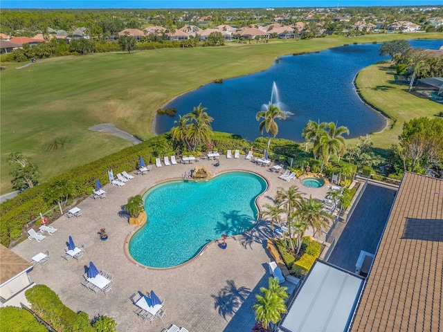 view of swimming pool featuring a water view