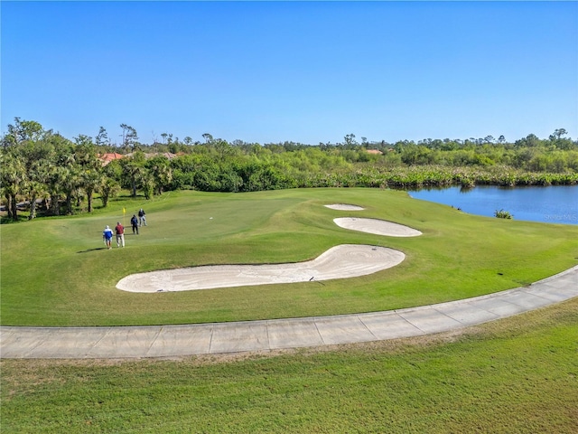 surrounding community featuring a yard and a water view