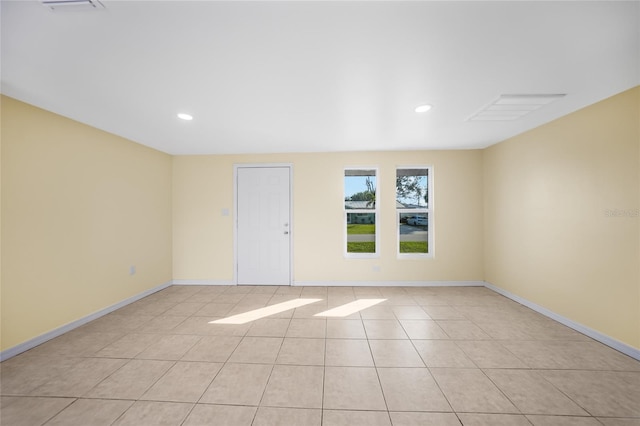 unfurnished room with light tile patterned floors