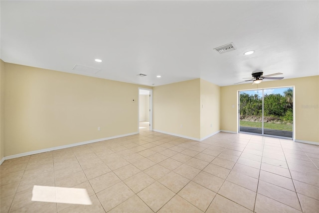 empty room featuring ceiling fan and light tile patterned flooring