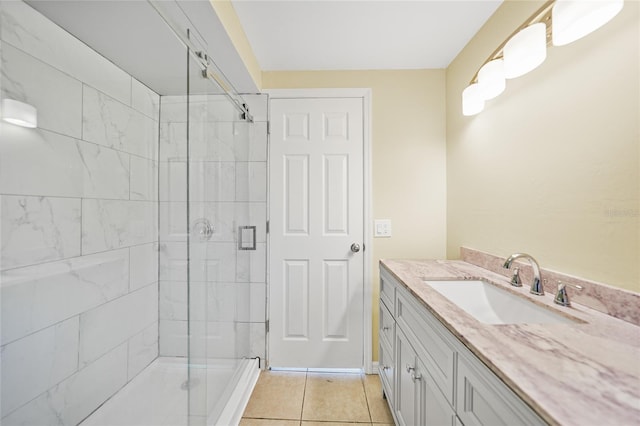 bathroom featuring tile patterned floors, vanity, and an enclosed shower