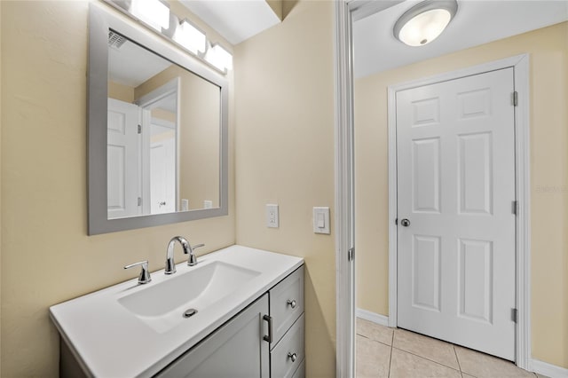 bathroom with tile patterned flooring and vanity