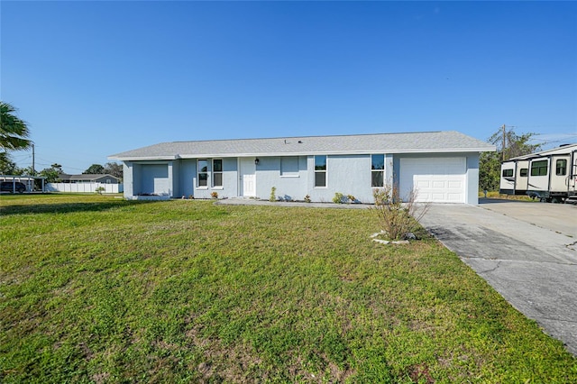 single story home with a garage and a front lawn