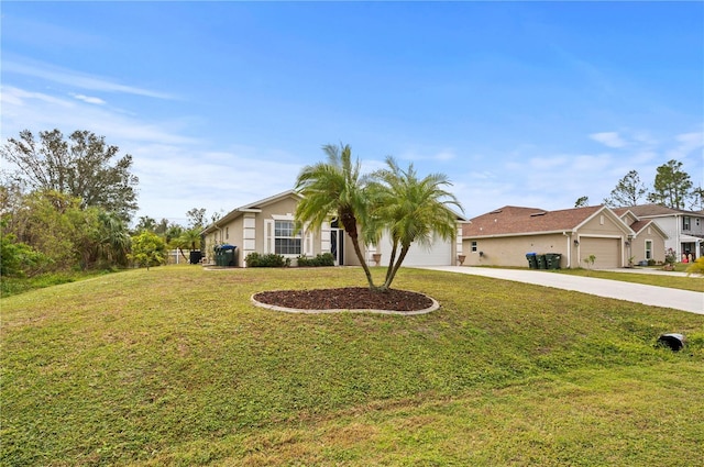 ranch-style house featuring a garage and a front lawn