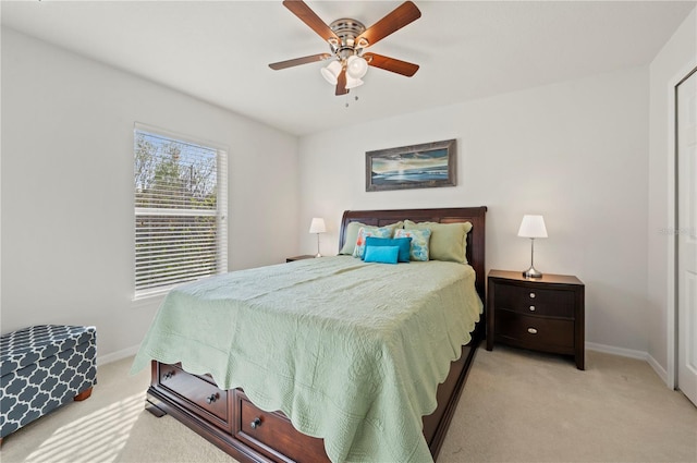 carpeted bedroom featuring ceiling fan