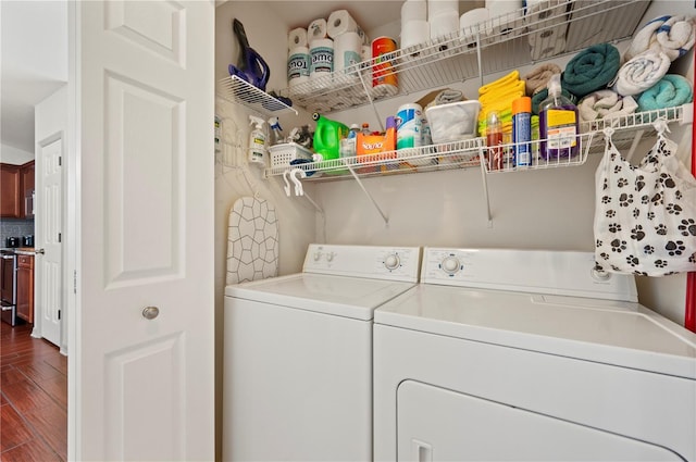 clothes washing area with hardwood / wood-style flooring and washer and clothes dryer